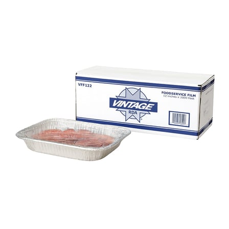 Tray filled with sliced food is tightly covered with clear 12 x 2000' heavy duty plastic wrap for food.jpg