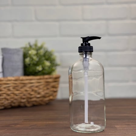 16 oz. Clear Boston Round Glass Bottle with Black Lotion Pump