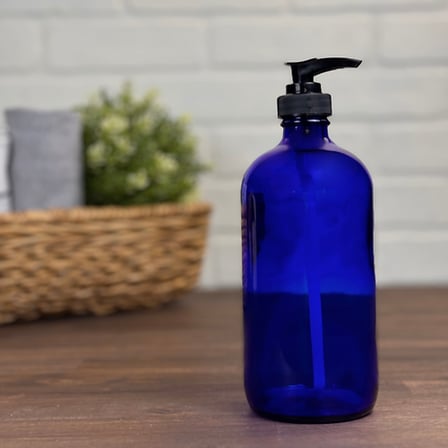 16 oz. Cobalt Blue Boston Round Glass Bottle with Black Lotion Pump