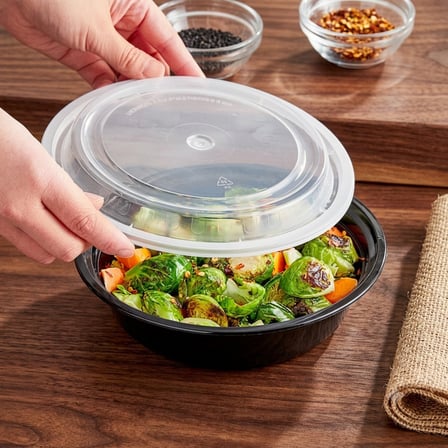 24 Ounce Black Round Microwavable Container With Food and Lid.jpg