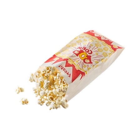 Freshly popped popcorn spilling from a 3.5 x 2″ x 8″ Popcorn bag.jpg