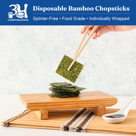9 Inches Individually Wrapped Bamboo Chopsticks holding seaweed.png