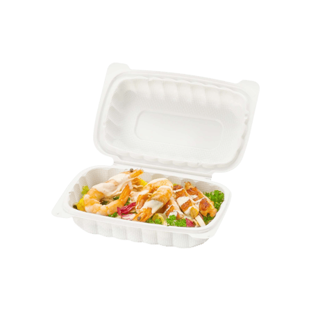 white takeout hinged lid container filled with a fresh salad & grilled chicken pieces