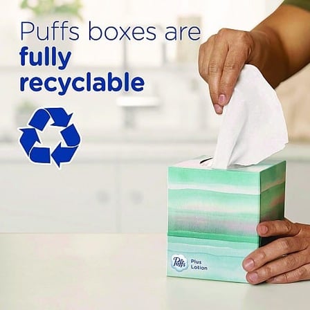 Hand Pulling a Tissue from a Recyclable Puffs Plus Lotion Facial Tissue box..jpg