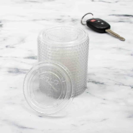 Stack of Solo 1 to 2.5 Ounce Clear PET Plastic Souffle Cup Lids.jpg