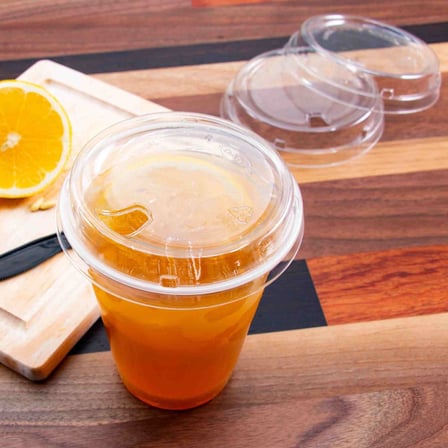 Solo Prima Clear PET Plastic Cold Cup Strawless With Lid on a Wooden Table.jpg