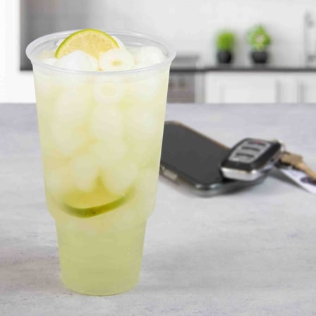 Solo Ultra Clear 32AC Clear Pedestal PET Plastic Cold Cup with Full off Lemonade.jpg
